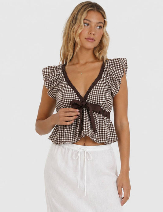 The Sutton Plaid Ruffle Sleeveless Bow Tie Peplum Top